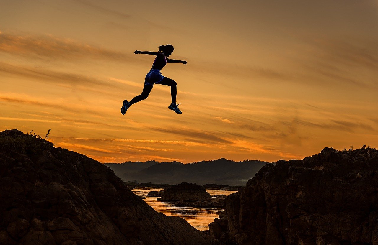 person jumping over water